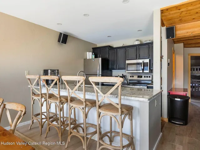 a kitchen with stainless steel appliances a refrigerator and a stove top oven