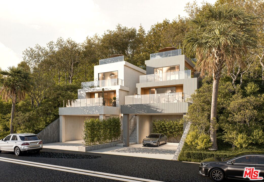 8536 Lookout Mountain Avenue Los Angeles, CA 90046 - Photo 1 of 7 a view of a car parked on the side of a street