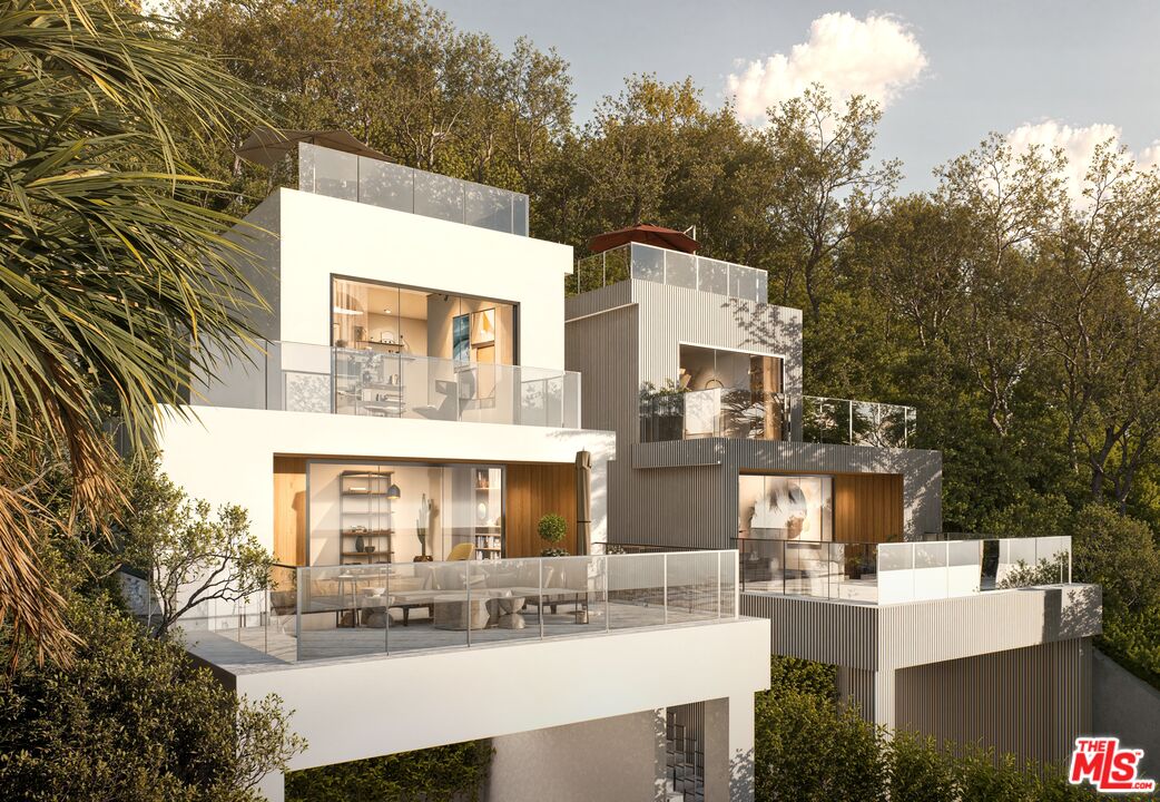 8536 Lookout Mountain Avenue Los Angeles, CA 90046 - Photo 3 of 7 a view of a building with a table and chairs