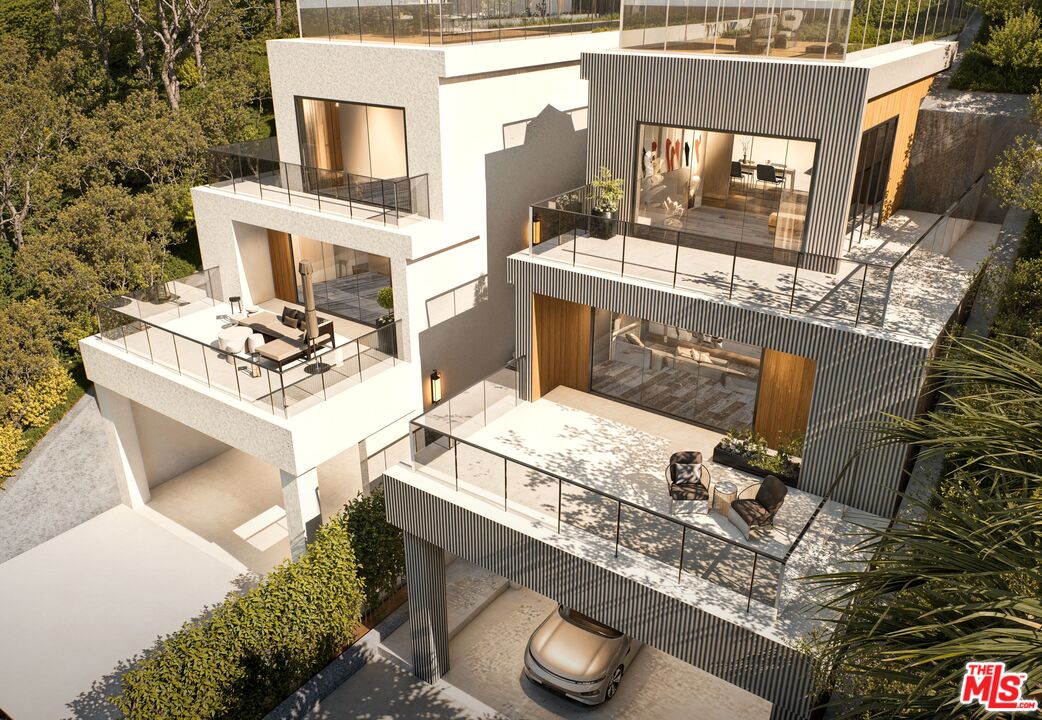 8536 Lookout Mountain Avenue Los Angeles, CA 90046 - Photo 7 of 7 a buildings covered with tall trees