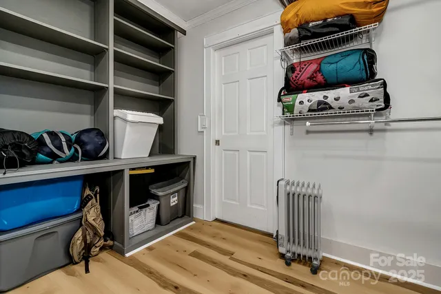 a view of a livingroom with wooden floor and a window