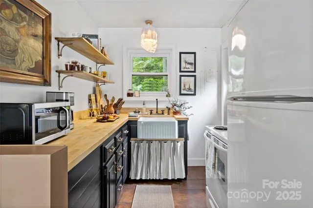a bathroom with a sink a mirror and a window