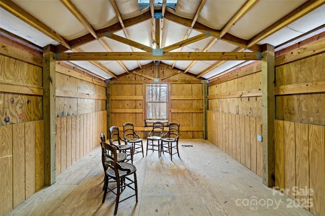 a view of a patio with table and chairs and potted plants