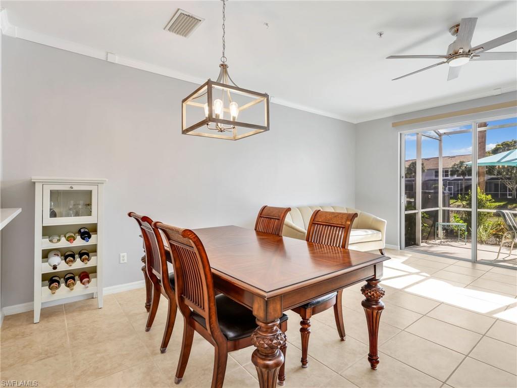 15918 Marcello Circle, Unit 239 Naples, FL 34110 - Photo 13 of 34 a view of a dining room with furniture window and outside view