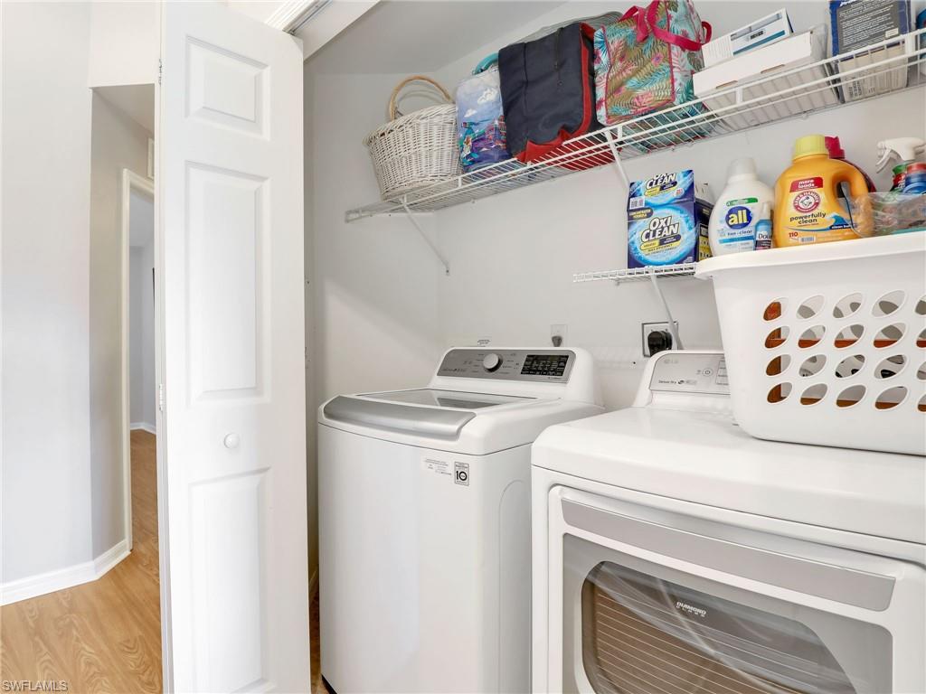 15918 Marcello Circle, Unit 239 Naples, FL 34110 - Photo 19 of 34 a utility room with dryer and washer