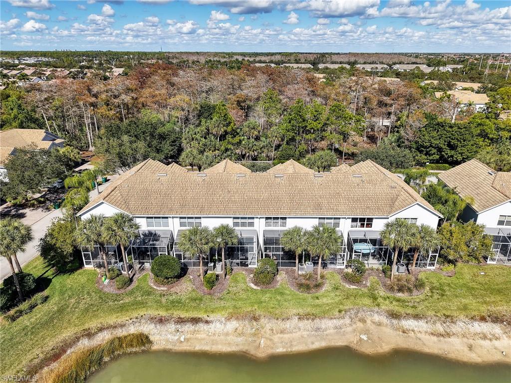 15918 Marcello Circle, Unit 239 Naples, FL 34110 - Photo 28 of 34 an aerial view of residential houses with outdoor space and swimming pool