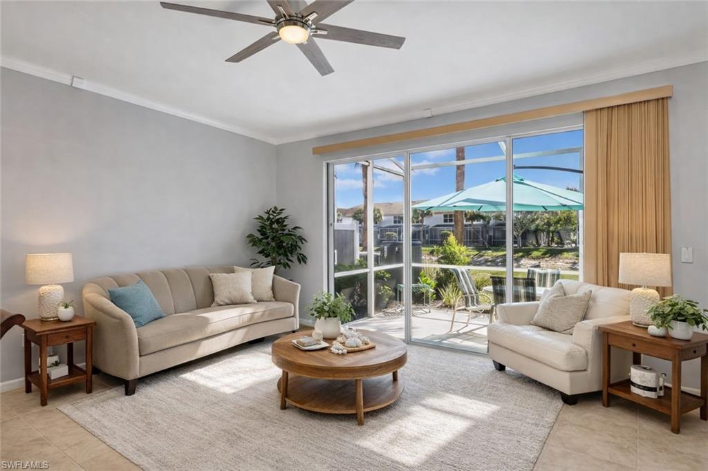 15918 Marcello Circle, Unit 239 Naples, FL 34110 - Photo 6 of 34 a living room with furniture and a large window
