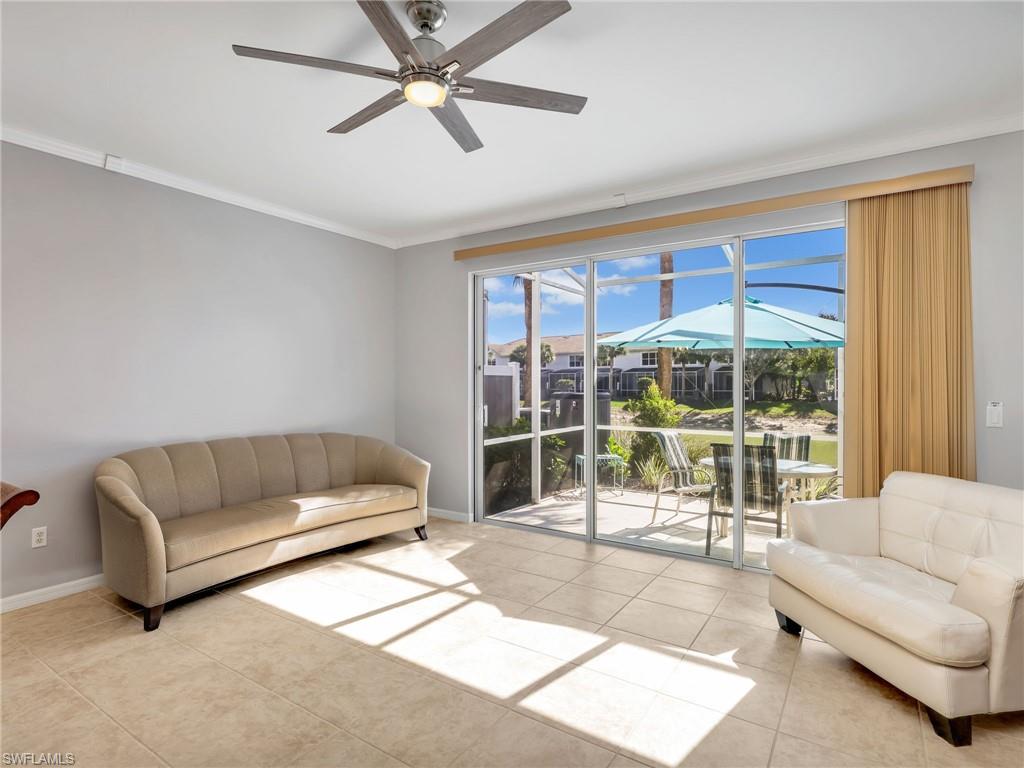 15918 Marcello Circle, Unit 239 Naples, FL 34110 - Photo 7 of 34 a living room with furniture and a large window