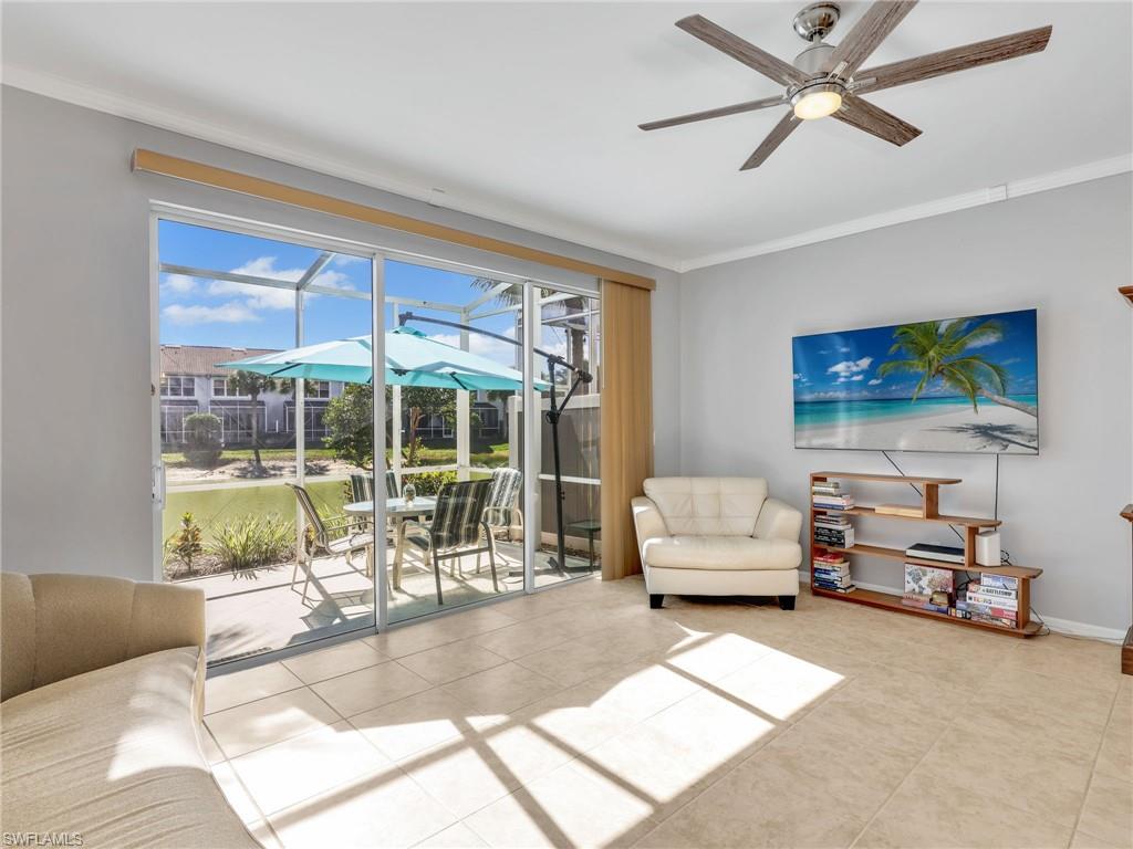 15918 Marcello Circle, Unit 239 Naples, FL 34110 - Photo 8 of 34 a living room with furniture and a large window
