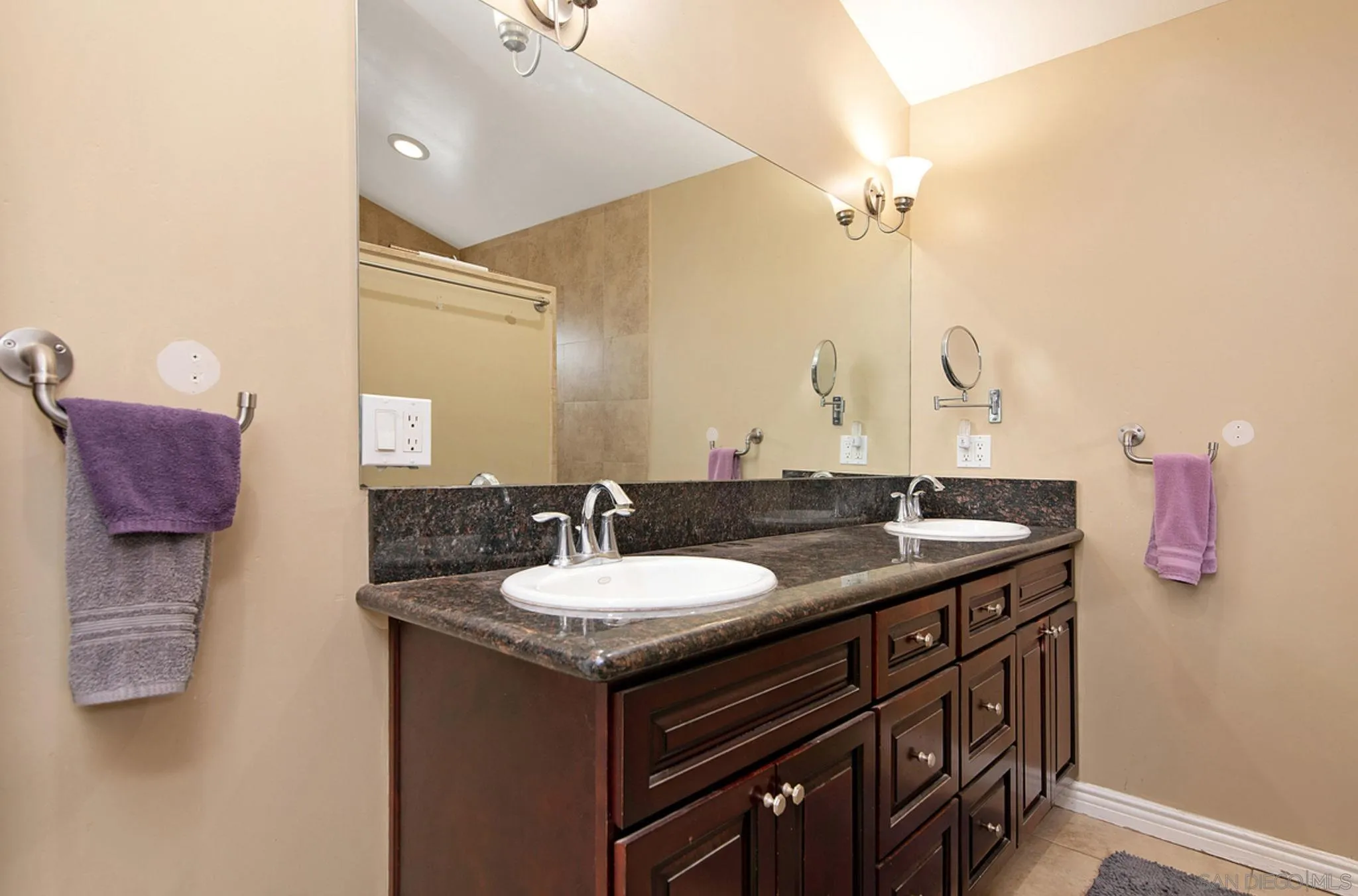 12764 Cumbres Road Valley Center, CA 92082 - Photo 8 of 22 a bathroom with a granite countertop sink and a mirror