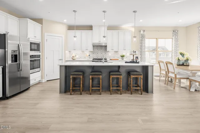a picture of a kitchen with stainless steel appliances