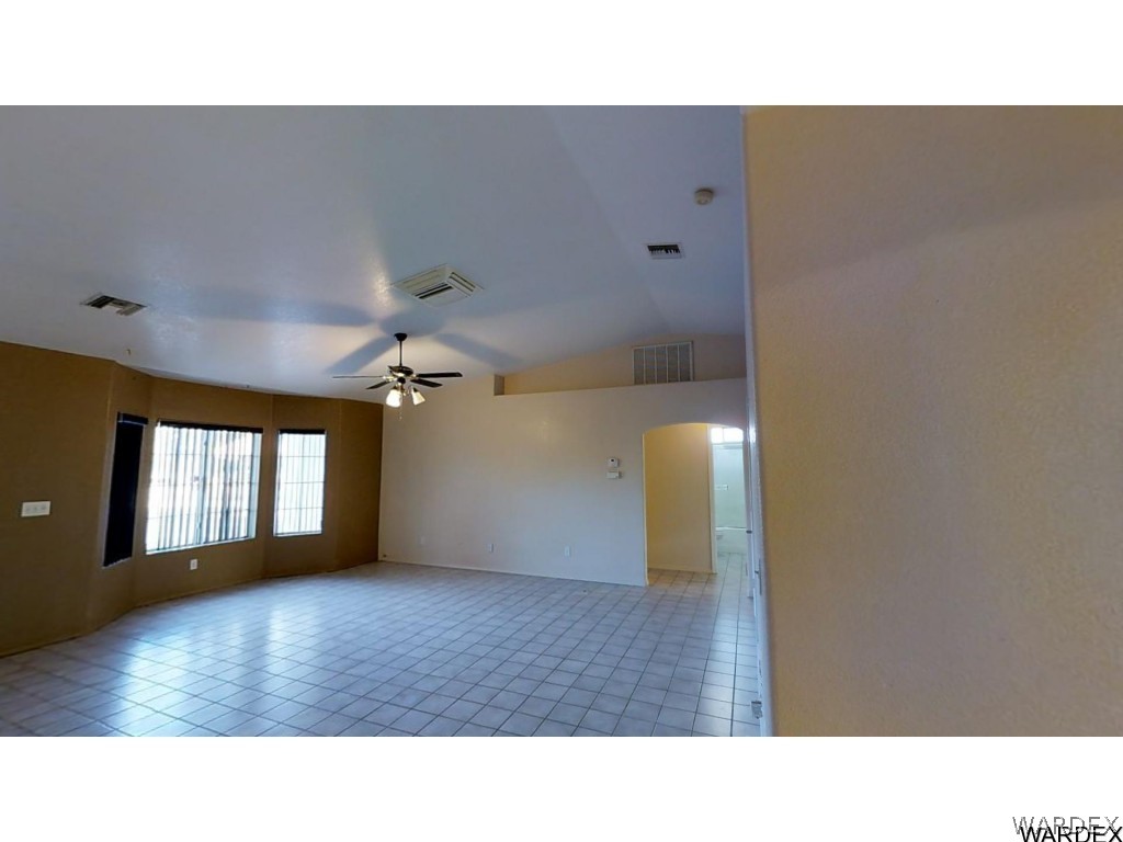 5850 Tableau Road Fort Mohave, AZ 86426 - Photo 3 of 20 a open hall with a hardwood floor