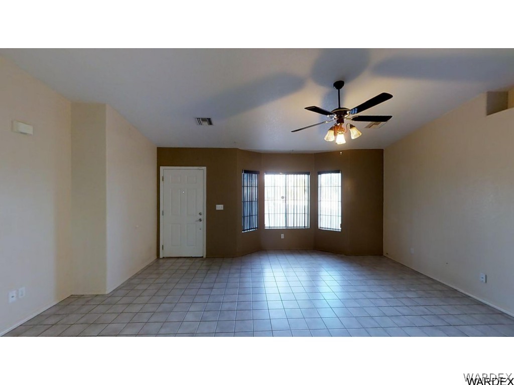 5850 Tableau Road Fort Mohave, AZ 86426 - Photo 5 of 20 a living room with furniture and a large window