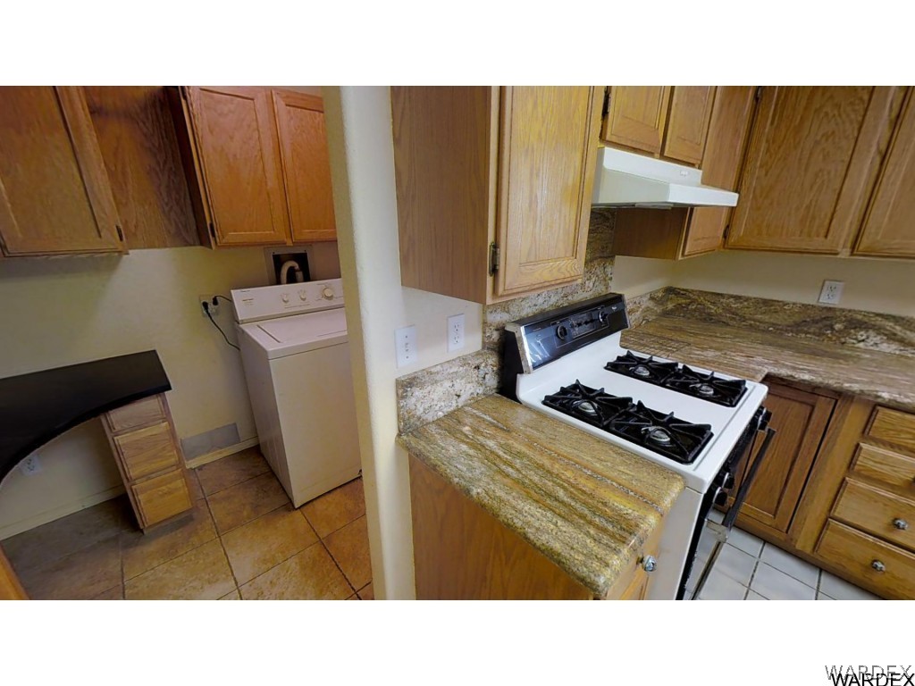 5850 Tableau Road Fort Mohave, AZ 86426 - Photo 7 of 20 a kitchen with a stove and a microwave