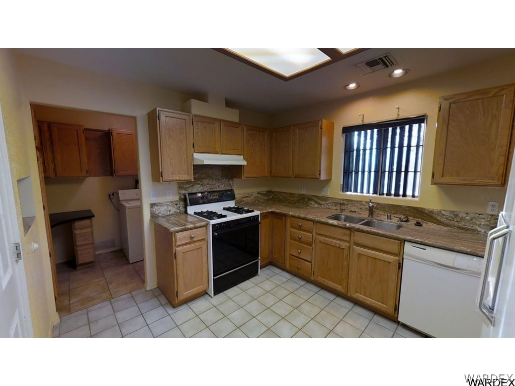 5850 Tableau Road Fort Mohave, AZ 86426 - Photo 8 of 20 a kitchen with a sink cabinets and stainless steel appliances