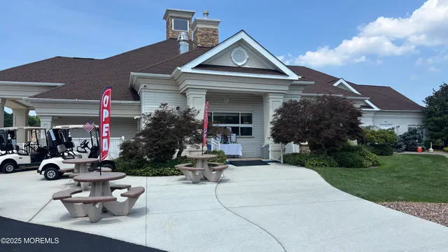 a view of a house with sitting area and garden