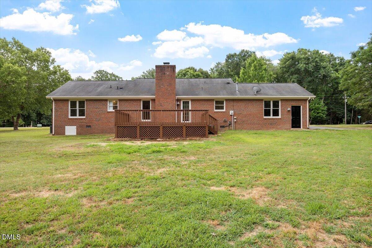 805 Rand Road Garner, NC 27529 - Photo 11 of 38 a view of a house with a yard and sitting area