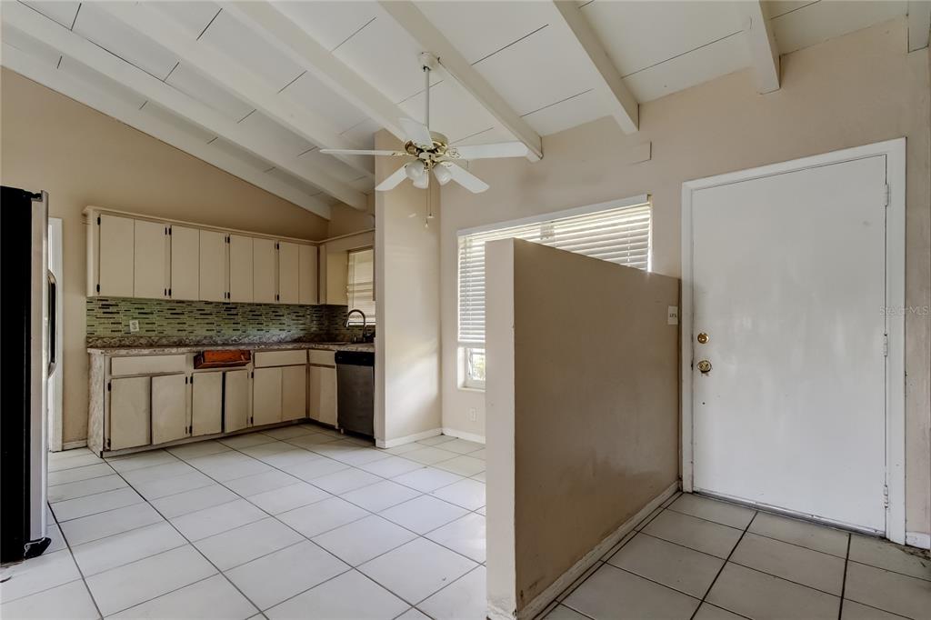 307 173rd Avenue North Redington Beach, FL 33708 - Photo 15 of 27 a kitchen with a refrigerator a sink and cabinets