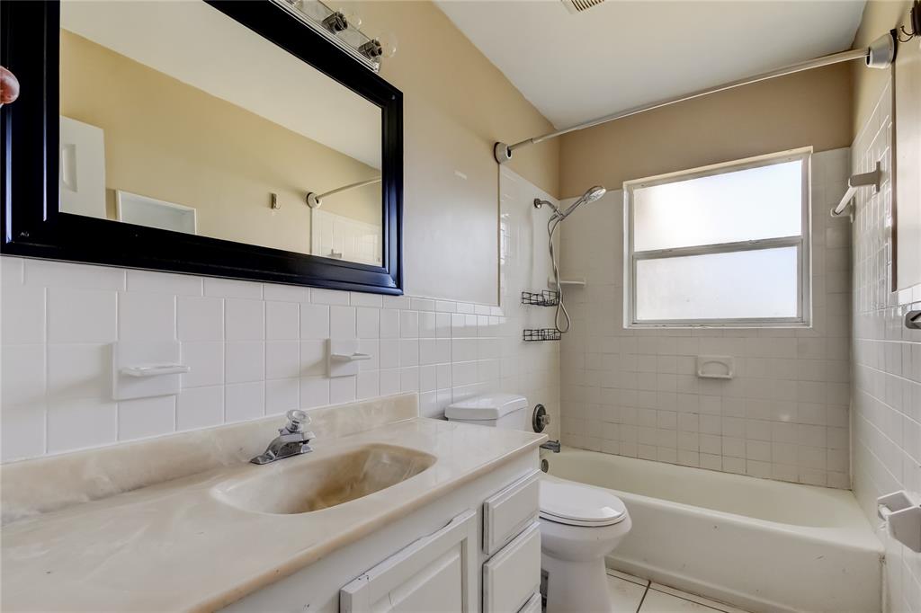 307 173rd Avenue North Redington Beach, FL 33708 - Photo 24 of 27 a bathroom with a sink a toilet and a bathtub