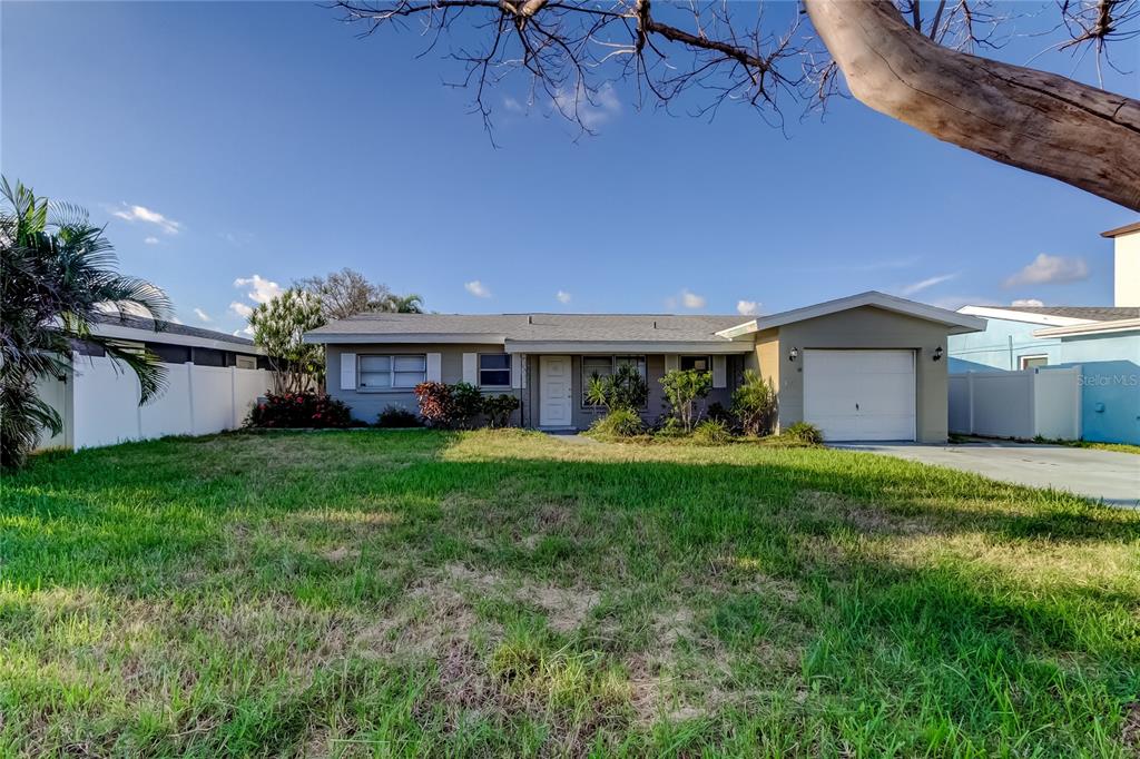 307 173rd Avenue North Redington Beach, FL 33708 - Photo 3 of 27 a view of a house with backyard and garden
