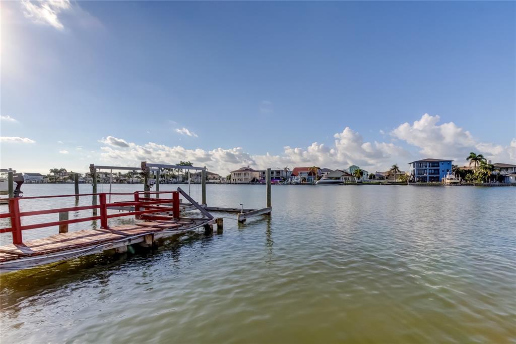 307 173rd Avenue North Redington Beach, FL 33708 - Photo 7 of 27 a view of a lake with chairs