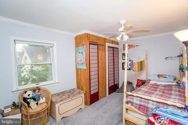 a bathroom with a shower and a glass door