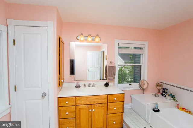 a bedroom with furniture and a book shelf