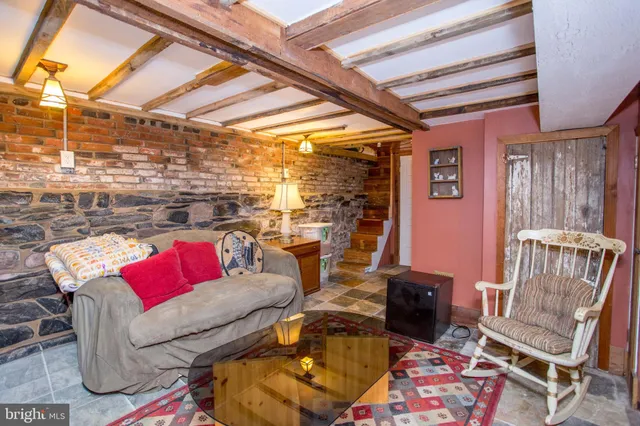 a view of a backyard with furniture and plants