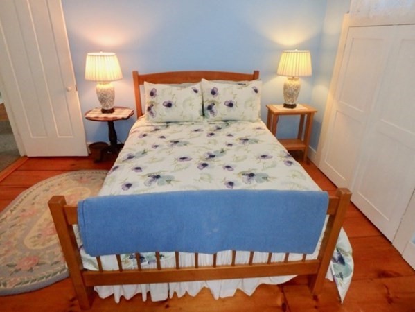 12 Cottle Lane Edgartown, MA 02539 - Photo 15 of 29 a bedroom with a bed and lamp on dresser