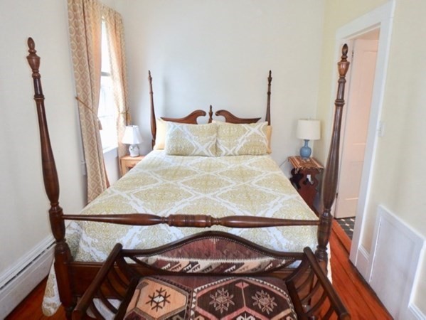 12 Cottle Lane Edgartown, MA 02539 - Photo 21 of 29 a bed sitting in a bedroom next to a window