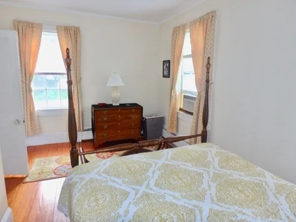 a room with a bed and a mirror