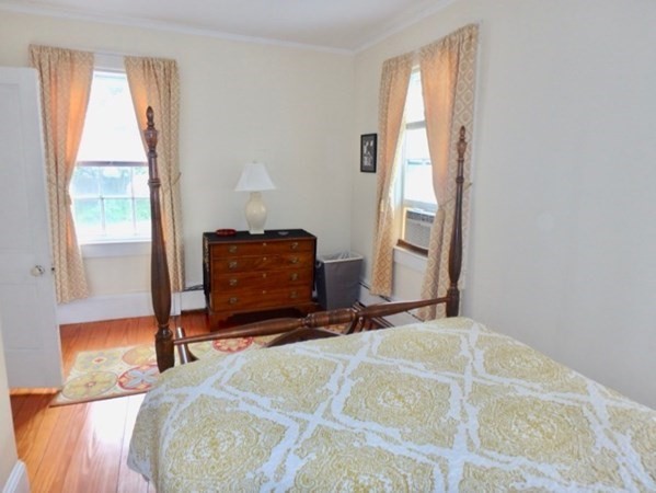 12 Cottle Lane Edgartown, MA 02539 - Photo 26 of 29 a room with a bed and a mirror