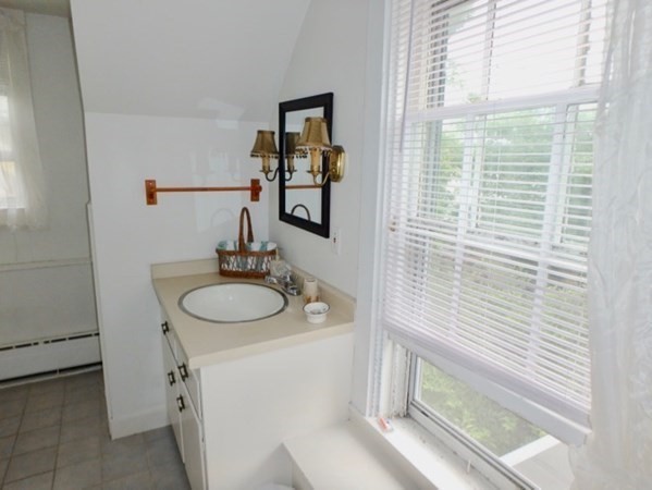 12 Cottle Lane Edgartown, MA 02539 - Photo 29 of 29 a bathroom with a sink and a mirror
