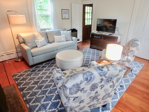 12 Cottle Lane Edgartown, MA 02539 - Photo 7 of 29 a living room with furniture a flat screen tv and a fireplace