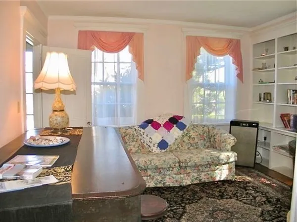 a living room with furniture and a table