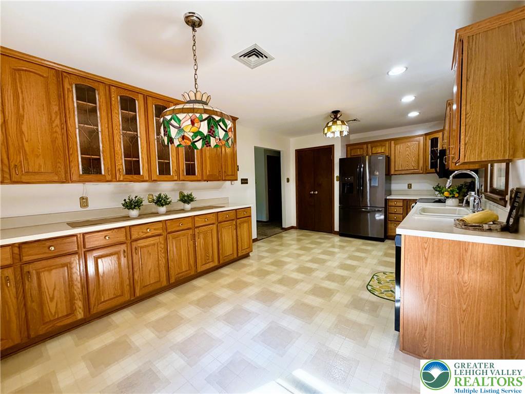 525 Pinewood Road Lehighton, PA 18235 - Photo 13 of 51 Rich wood cabinetry runs the whole length of the kitchen & dining areas