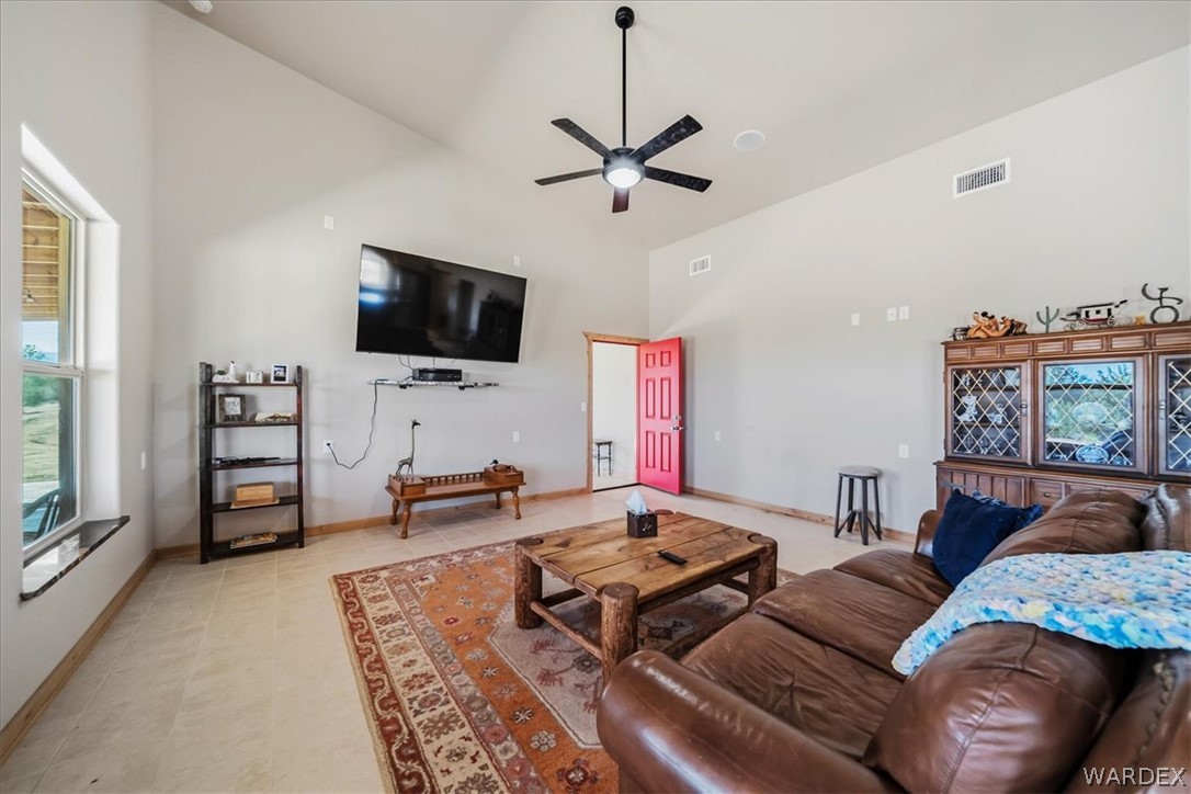 10374 East Happy Trails Road Kingman, AZ 86401 - Photo 10 of 68 a living room with furniture and a flat screen tv