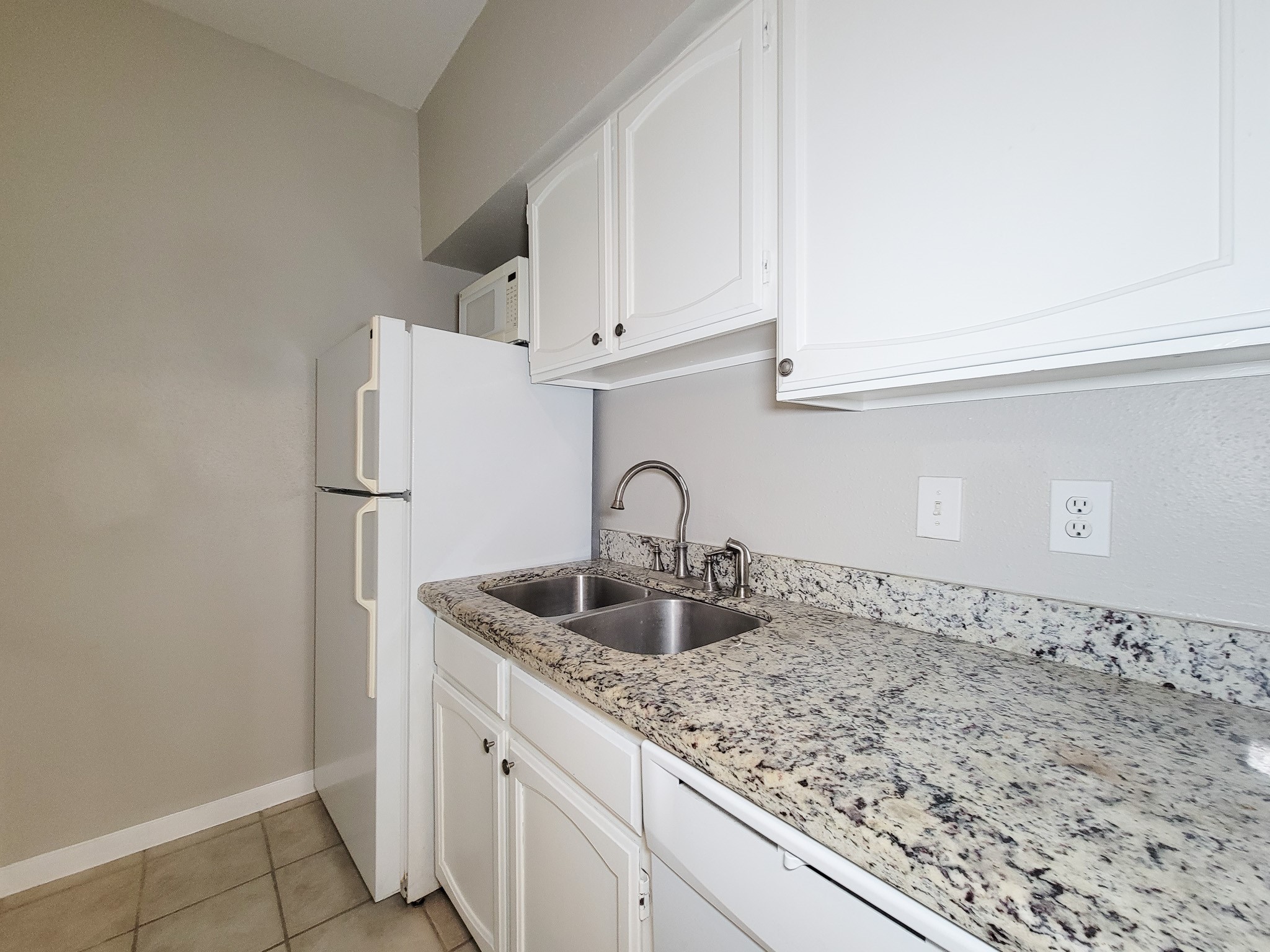 4041 Drake Street, Unit 116 Houston, TX 77005 - Photo 11 of 27 a close view of sink and tap
