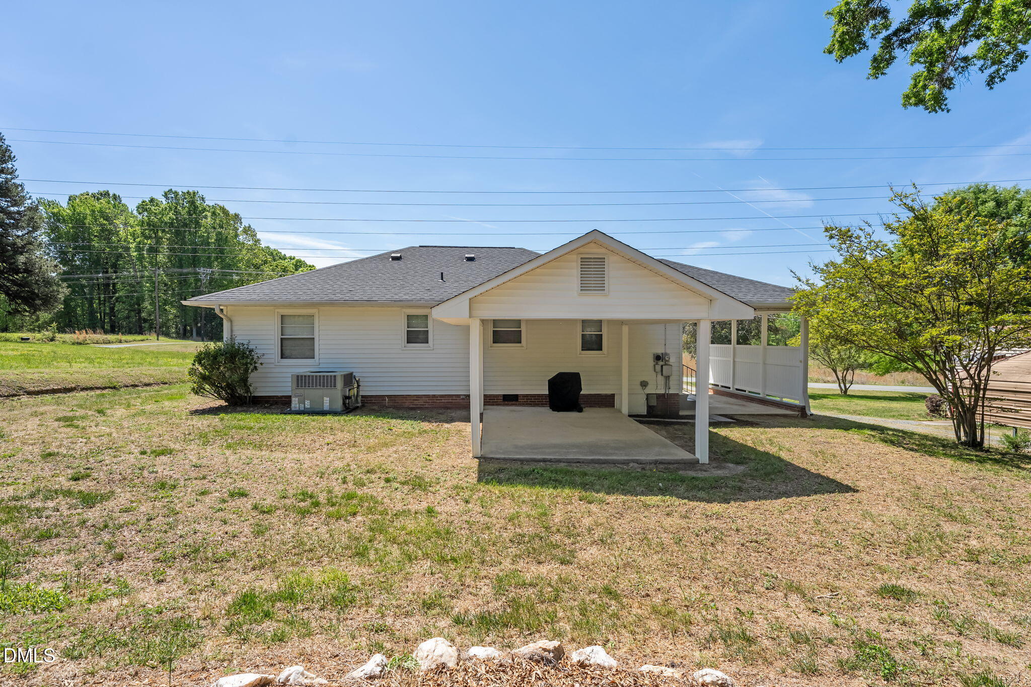 1723 Power Line Road Elon, NC 27244 - Photo 21 of 22 a view of a house with a yard