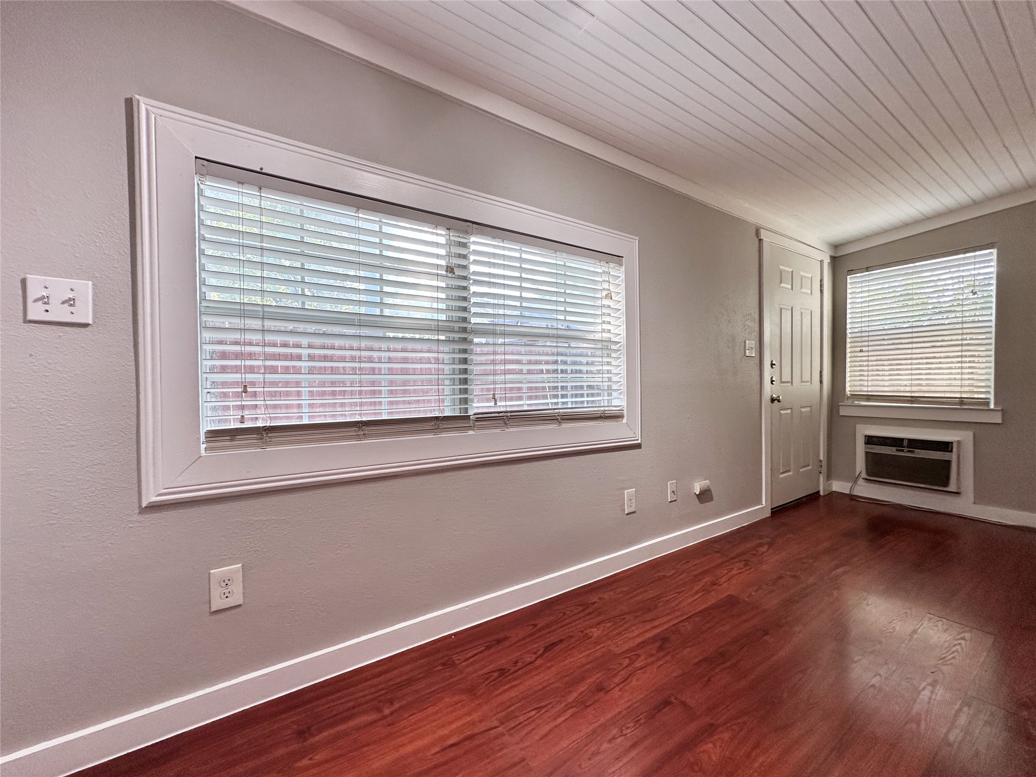 2103 East 16th Street, Unit ANNEX Austin, TX 78702 - Photo 15 of 23 a view of an empty room with wooden floor and a window