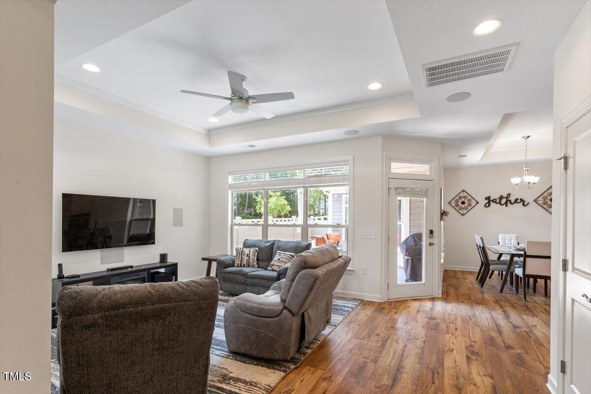 1357 Prevenient Drive Wake Forest, NC 27587 - Photo 12 of 58 a living room with furniture and a flat screen tv