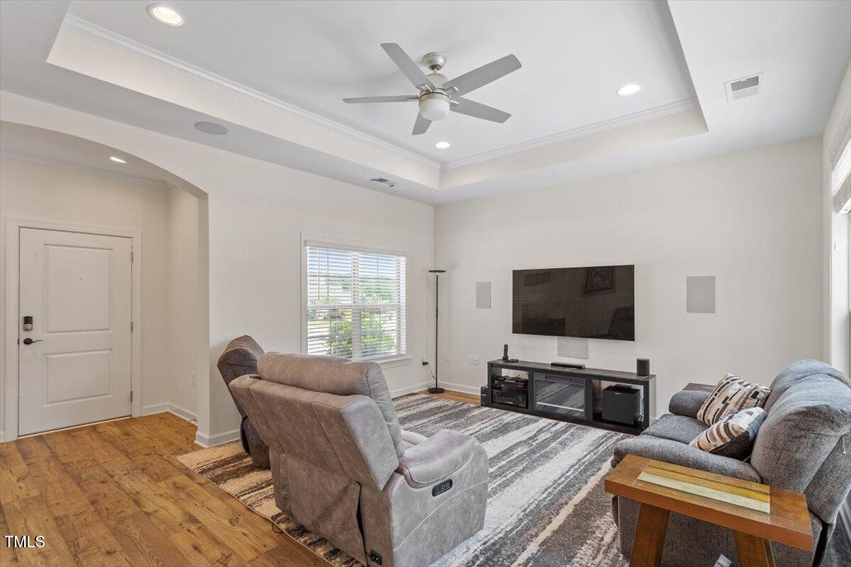 1357 Prevenient Drive Wake Forest, NC 27587 - Photo 23 of 58 a living room with furniture and a flat screen tv