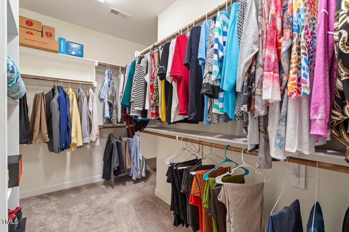 1357 Prevenient Drive Wake Forest, NC 27587 - Photo 37 of 58 a view of walk in closet with clothes and shoes
