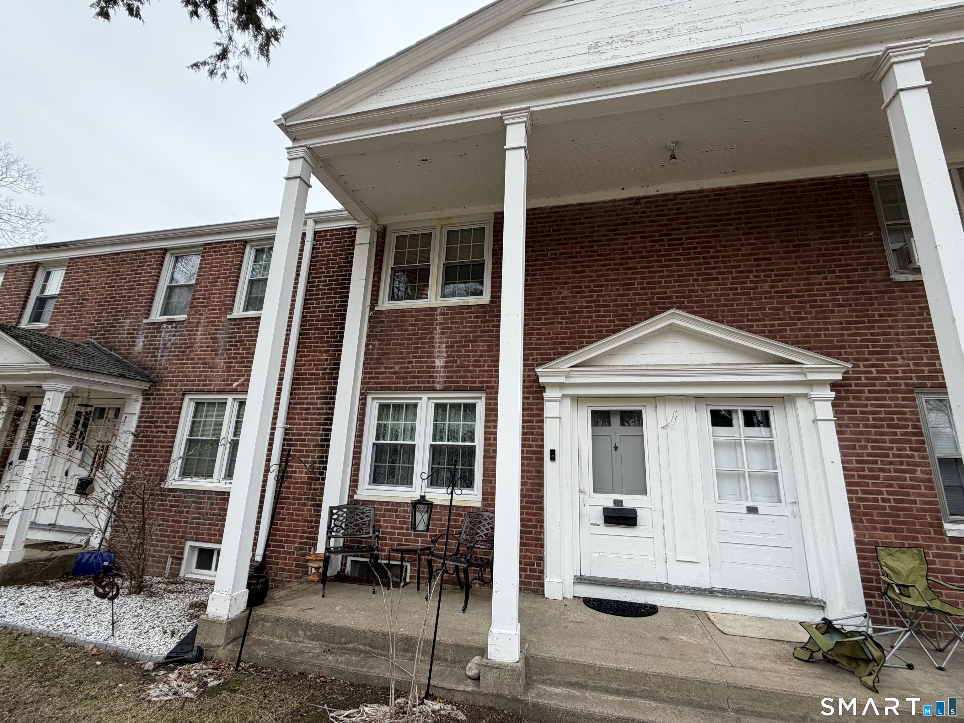 18 Bridge Street, Unit 2C Naugatuck, CT 06770 - Photo 19 of 23 a front view of a house with glass windows