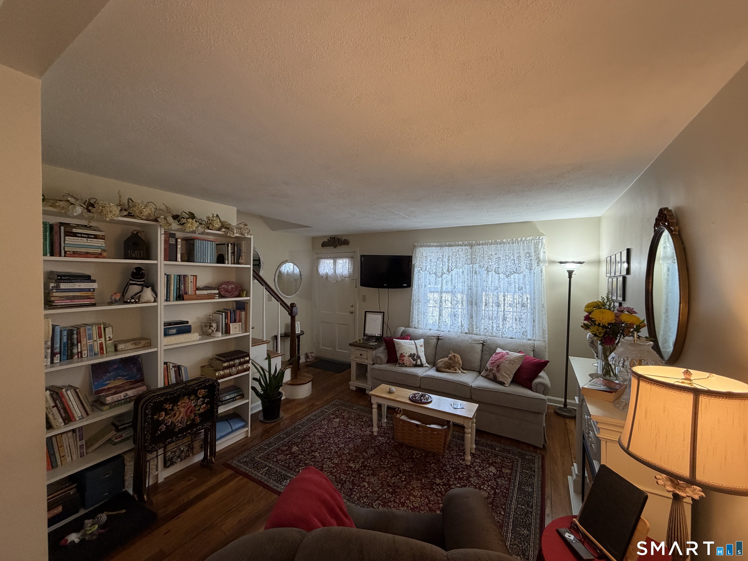 18 Bridge Street, Unit 2C Naugatuck, CT 06770 - Photo 3 of 23 a living room with furniture a rug and a window