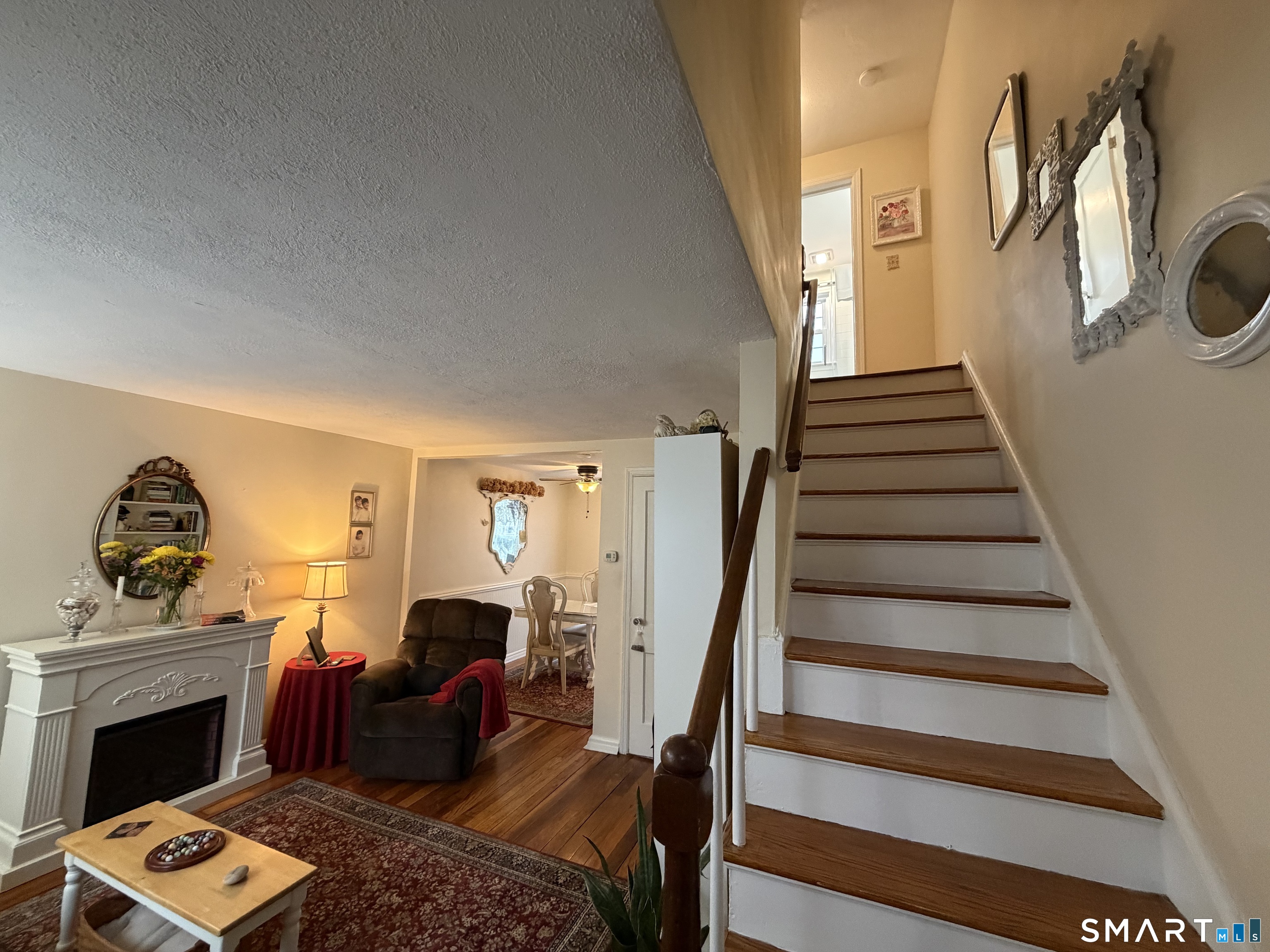18 Bridge Street, Unit 2C Naugatuck, CT 06770 - Photo 4 of 23 a living room with furniture and a fireplace