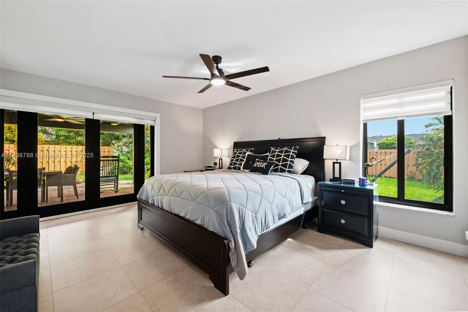 11471 Southwest 105th Terrace Miami, FL 33176 - Photo 12 of 41 a bedroom with a large bed and a large window