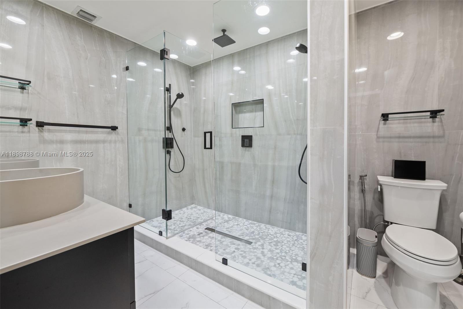 11471 Southwest 105th Terrace Miami, FL 33176 - Photo 17 of 41 a bathroom with a sink a toilet and shower