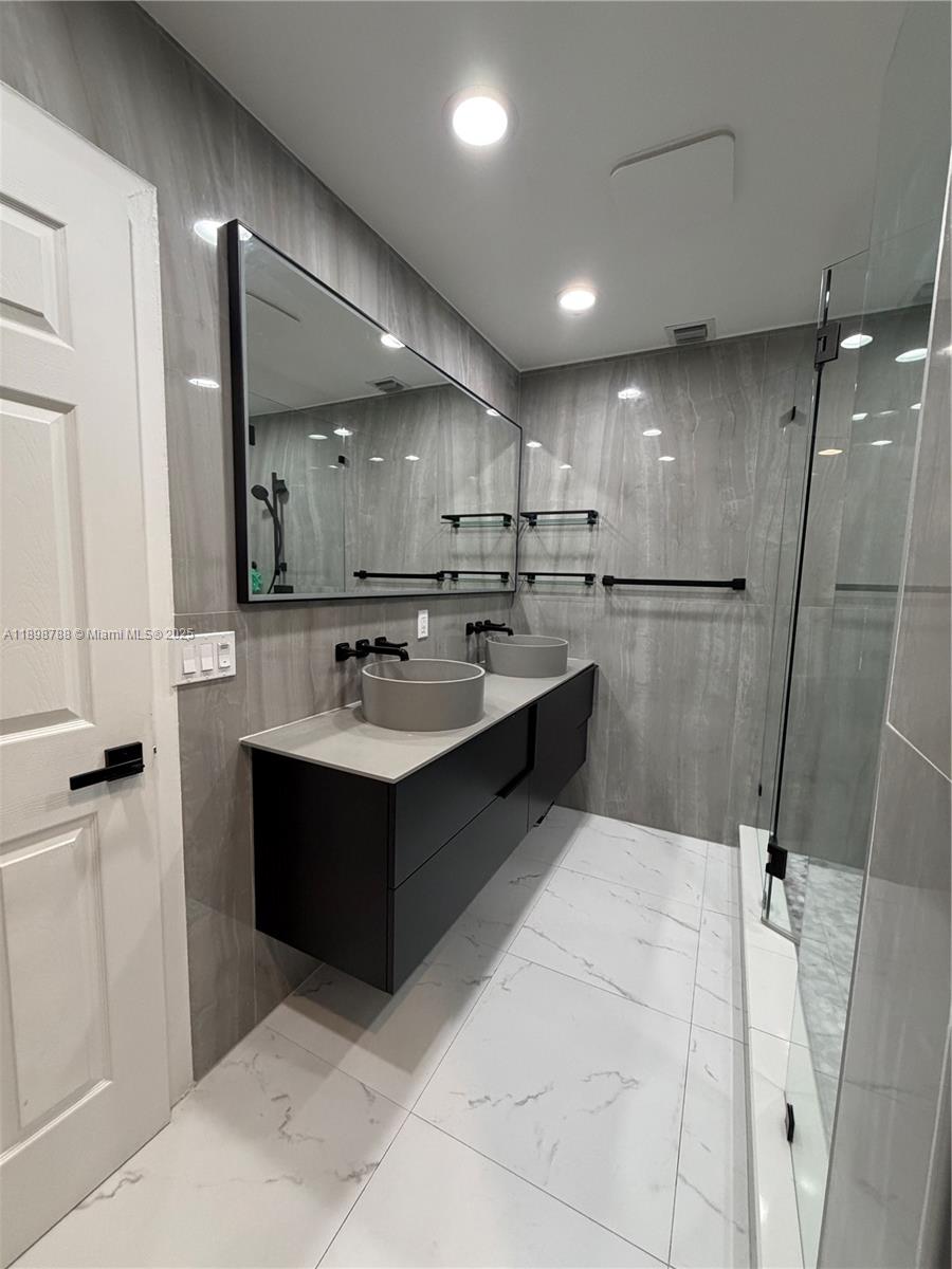 11471 Southwest 105th Terrace Miami, FL 33176 - Photo 18 of 41 a large white kitchen with a sink window and stainless steel appliances