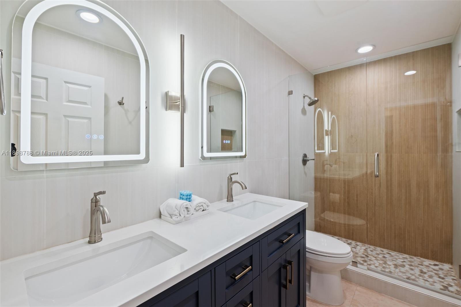 11471 Southwest 105th Terrace Miami, FL 33176 - Photo 20 of 41 a bathroom with a double vanity sink toilet and shower